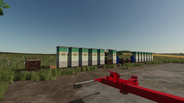 fs25-mods,  FS25 Beehives Pack mod v1.0.0.0 featuring multiple beehives and equipment in a scenic field setting.