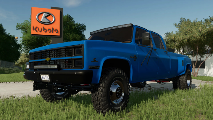 fs22-mods, Blue Chevrolet K30 Dually truck mod for FS22 parked near Kubota sign in Farming Simulator 22.