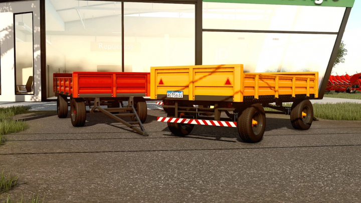 fs22-mods, Mod FS22 Lizard 4TT che mostra rimorchi rossi e arancioni in Farming Simulator 22.