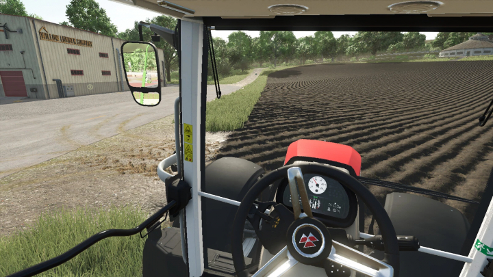 fs25-mods,  Realistic Cab View mod in Farming Simulator 25 shows interior tractor view with fields and buildings in the background.