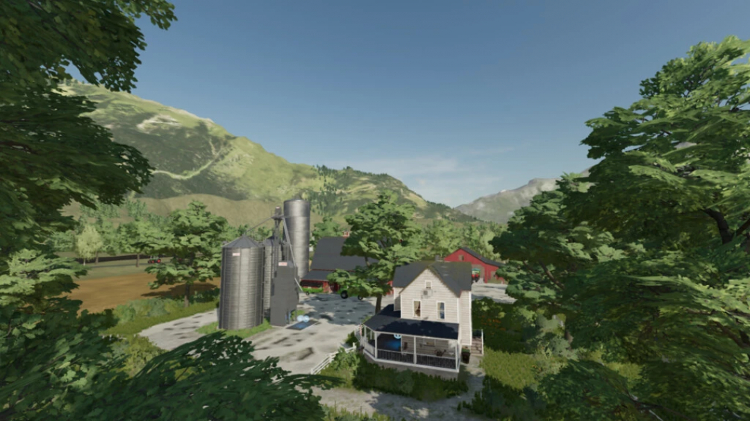 Paysage de ferme pittoresque dans le mod FS22 Arkansas Of American avec silos et maison de ferme.