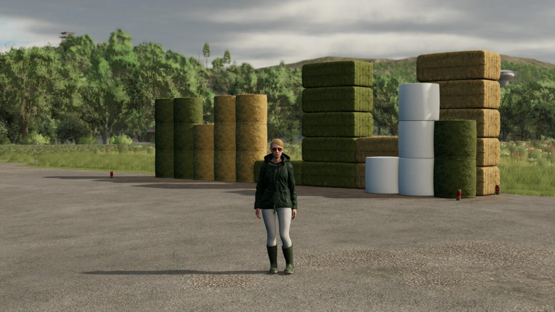 Mod FS25 Balestorage v1.0.0.0 con balle impilate e un personaggio davanti, in un'area erbosa.