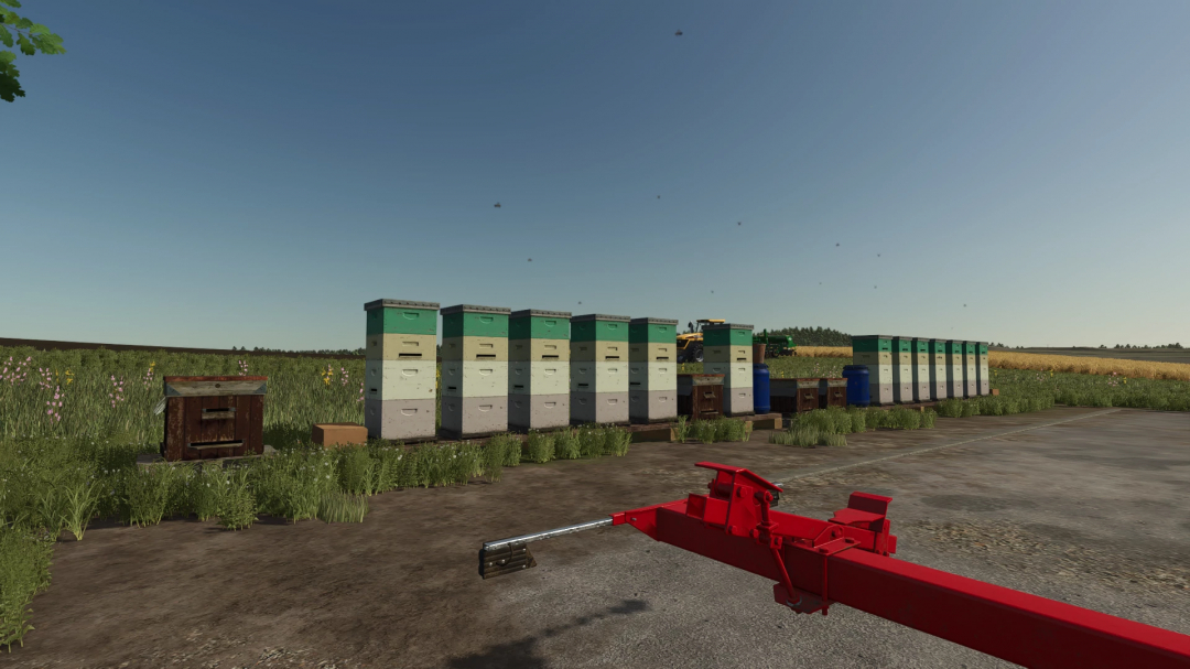 FS25 Beehives Pack mod v1.0.0.0 featuring multiple beehives and equipment in a scenic field setting.