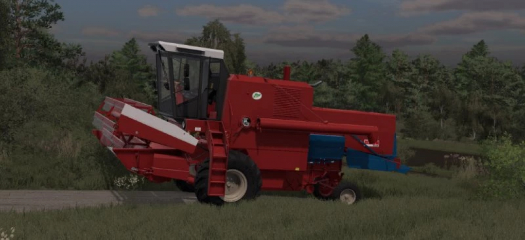 Colheitadeira Bizon Z-050/Z-056/Z-057 vermelha em caminho gramado no mod FS25.