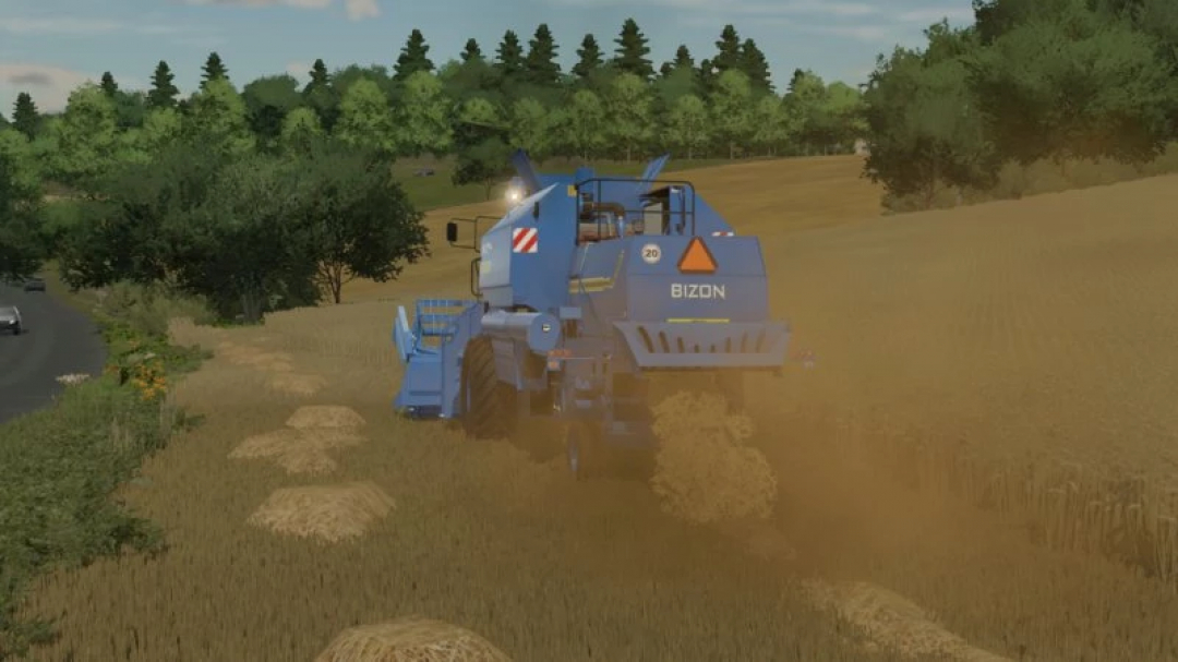 Mietitrebbia Bizon Z058 New Holland nel mod FS22 al lavoro in un campo di grano.