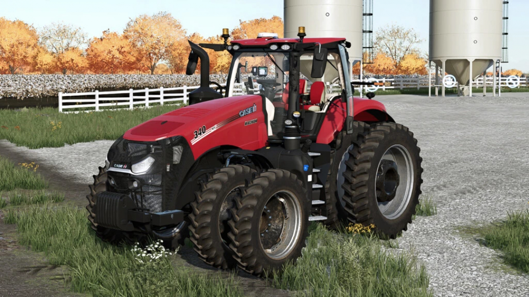 Tractor Case IH Magnum AFS US/EU mod en FS22 con neumáticos dobles, aparcado en granja con árboles otoñales.