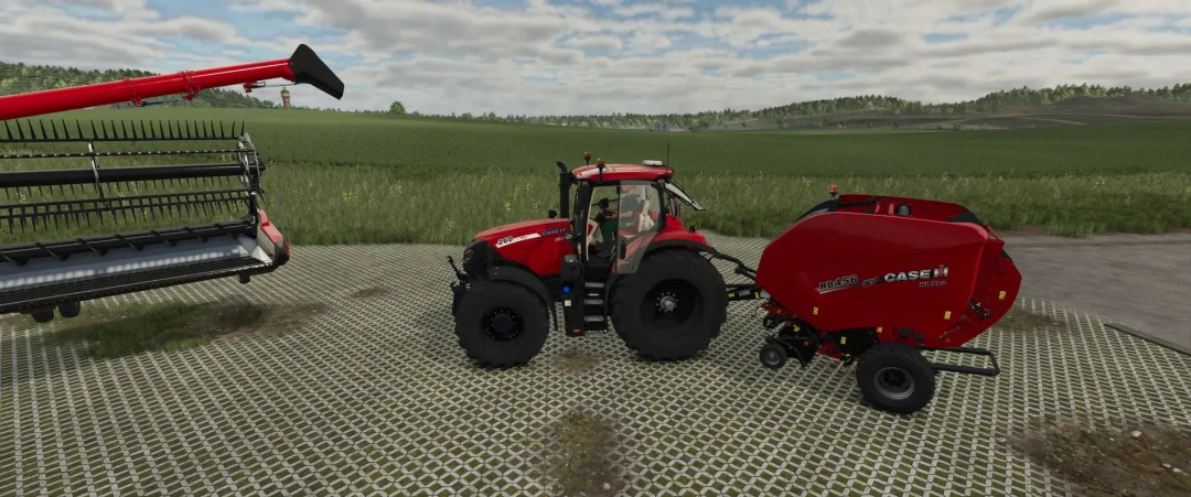 Case IH tractor with baler in FS25 mods, featuring a red design and wide field backdrop.