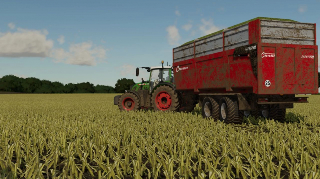 FS22 mod Chevance FarmerGV trailer in a field with a tractor.