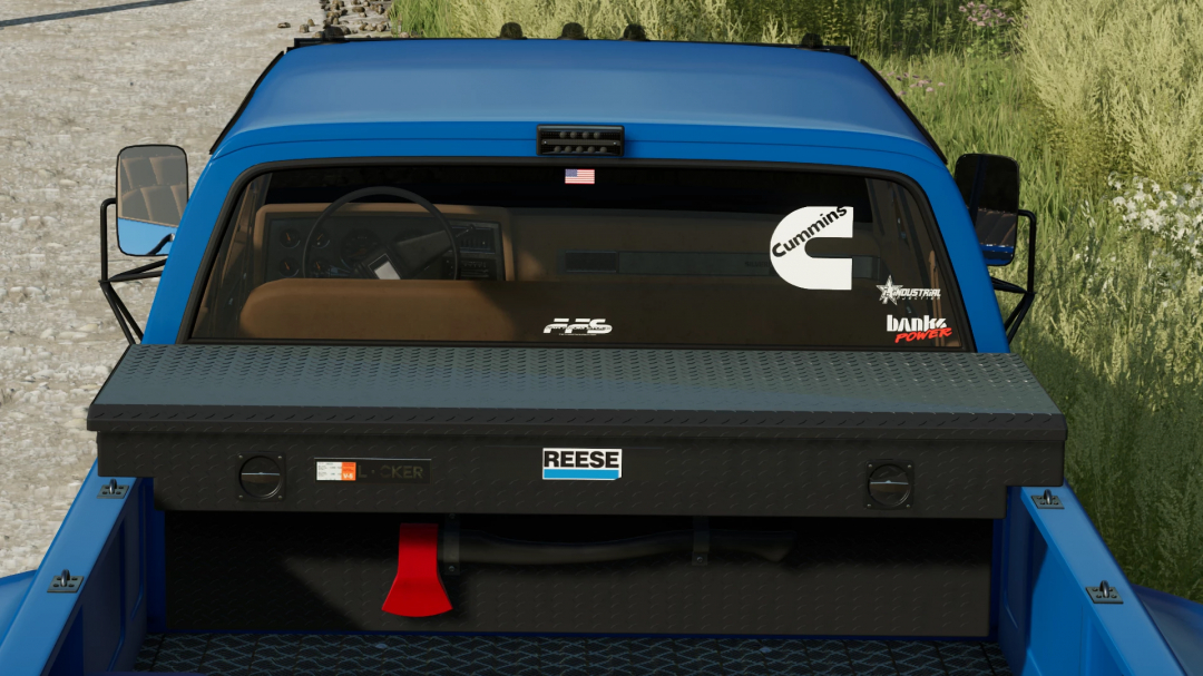 Rear view of a blue Chevrolet K30 Dually in FS22 mod with decals and storage box.