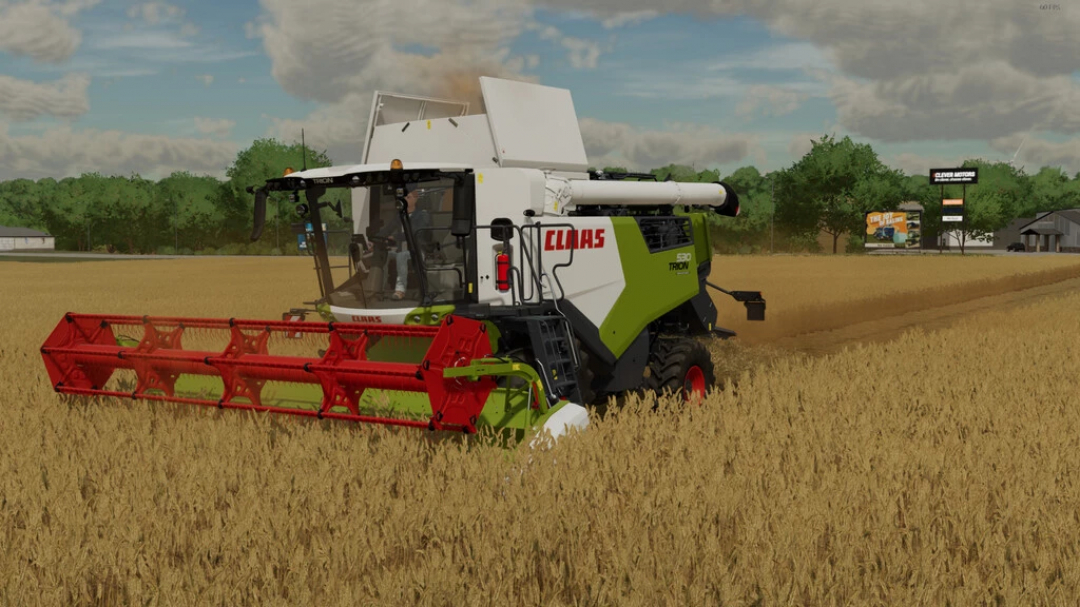 Claas Trion 530 harvester working in a wheat field in FS22 mods.