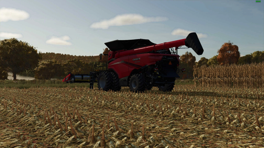 FS25 mod showing detailed corn trash textures with harvester in a field.