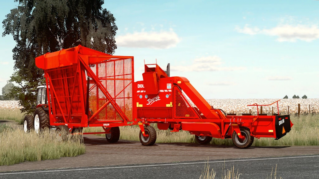 Mod FS22 Dolbi Javiyu Pack v1.0.0.0 montrant une machine de récolte rouge attachée à un tracteur dans un champ.