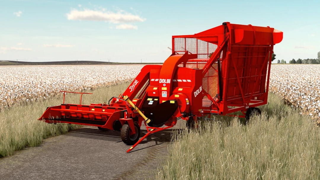 Dolbi Javiyu Pack v1.0.0.0 mod pour FS22 avec équipement agricole rouge dans un champ de coton.