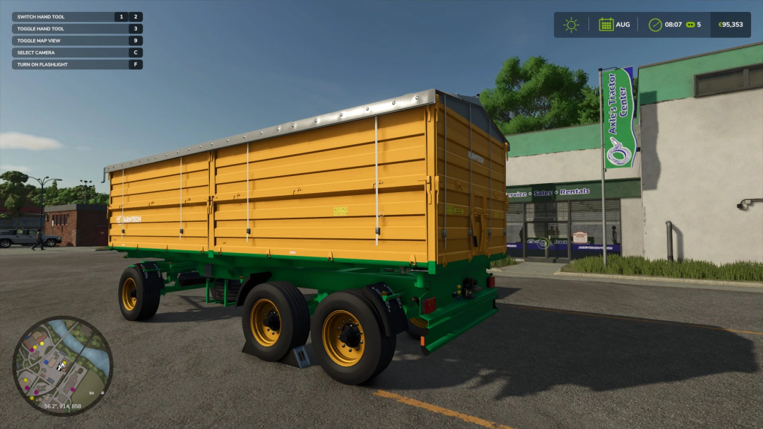 Reboque Farmtech Pack no FS25 no Axle's Tractor Center, com design amarelo e verde, parte dos mods do Farming Simulator 25.