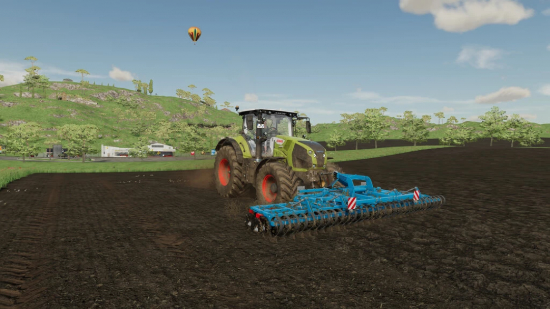 FS22 mod Gorenc Grinder 600 in use with a tractor on a farm field, showcasing Farming Simulator 22 mods.