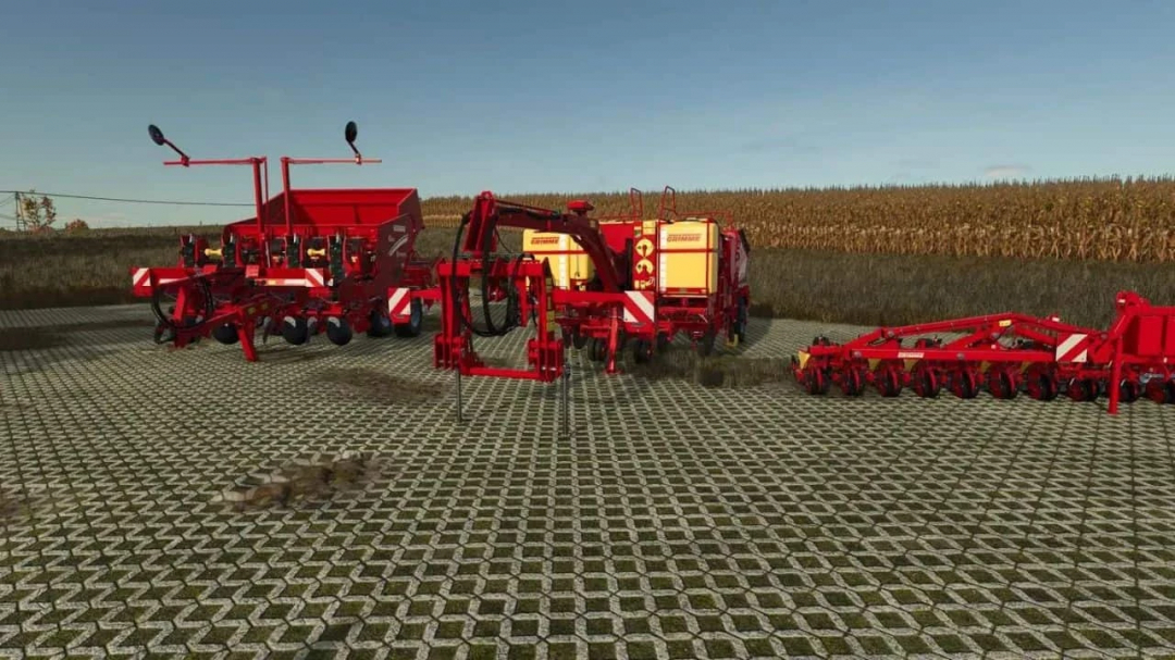 Three red Grimme farming machines from the Grimme Pack Multifruits mod in FS25 on a paved field.