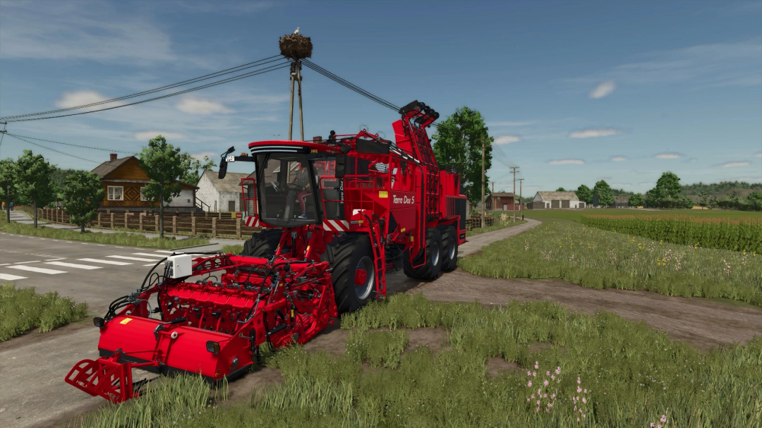 Holmer Terra Dos 5-40 harvester mod for FS25 on a rural road, surrounded by fields and houses.