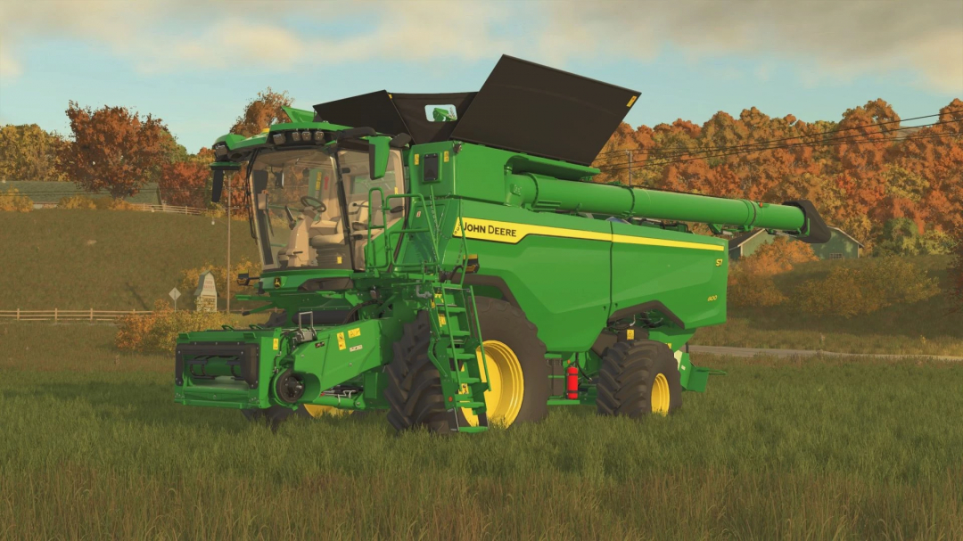 Colheitadeira John Deere S7 com configurações de pneus no mod FS25, mostrada em um campo gramado.