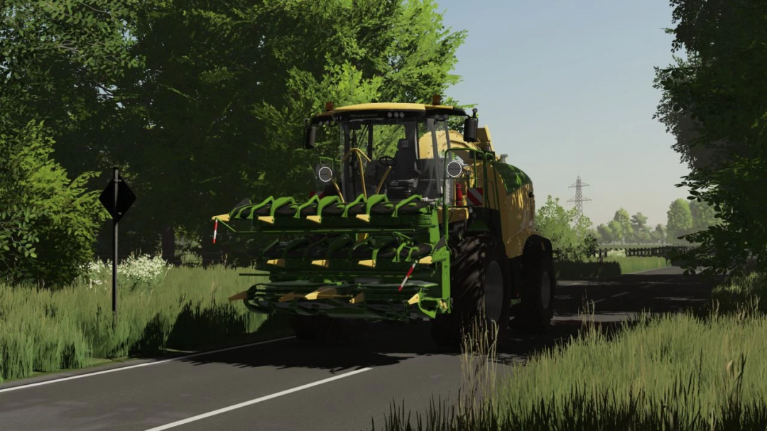 Mod Krone Big X 680-1180 do FS22 na drodze otoczonej drzewami, mody do Farming Simulator 22.