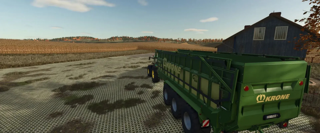 Krone Pack mod for FS25 showing a green trailer on a farm landscape.