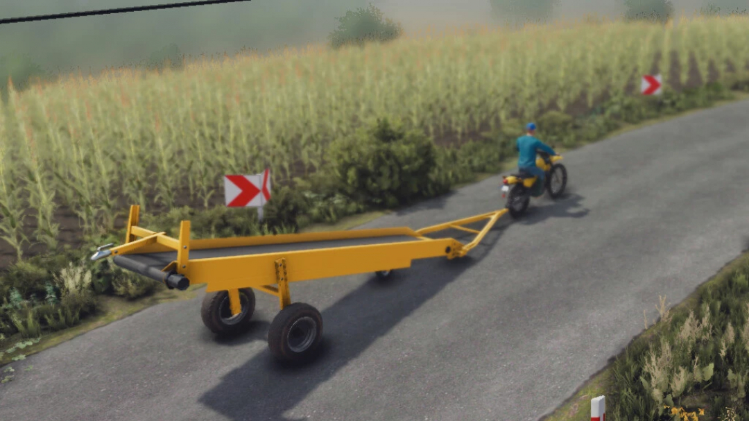 Mod FS22 Lizard DT 125 1990 v1.0.0.0 com reboque amarelo em uma estrada rural no Farming Simulator 22.