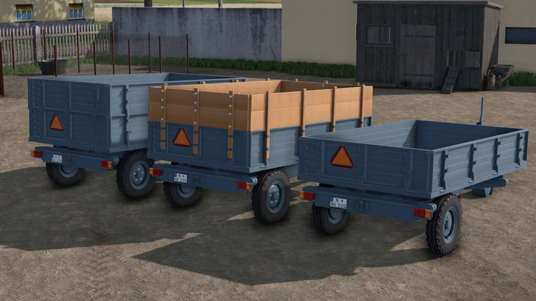 Three Lizard Loznica 5T trailers for FS22 mods in a farm setting, showcasing varying side panel designs.