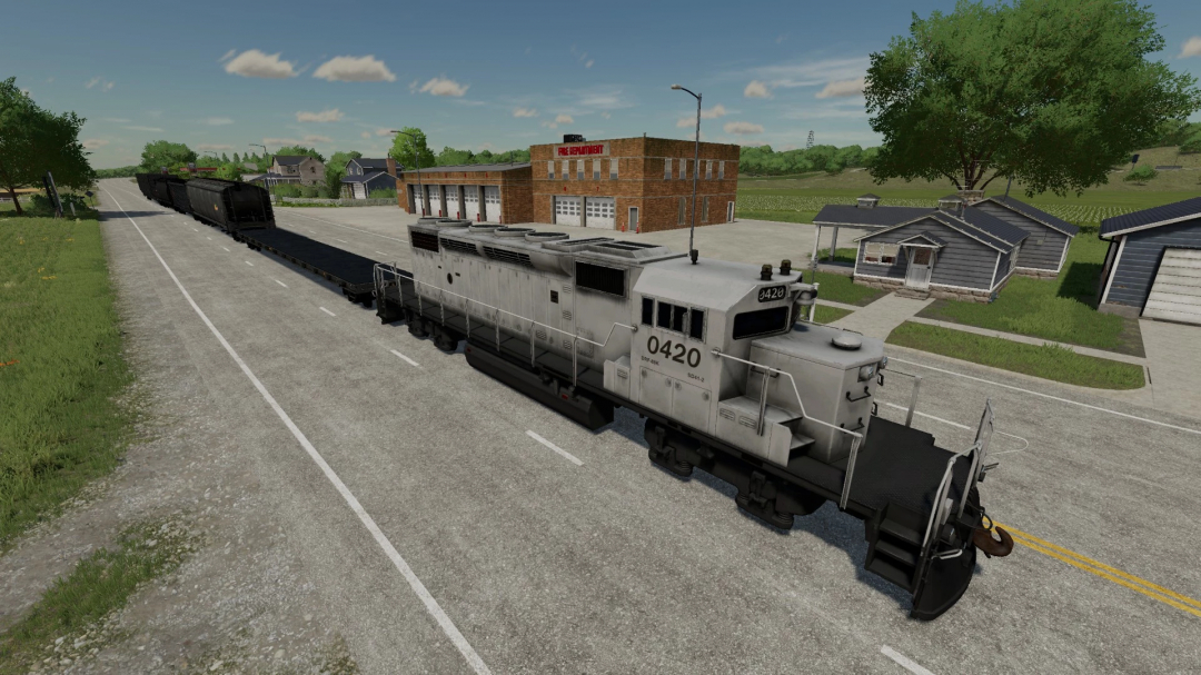 Lizard Train Pack v1.0.0.0 mod do FS22 z szczegółowym pociągiem na torach w wiejskim otoczeniu.