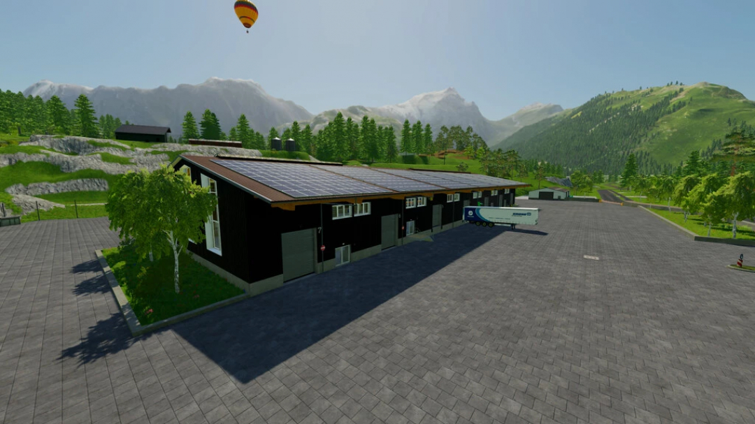 Centro de logística mod FS22, com grande armazém, docas de carga, painéis solares e paisagem montanhosa.