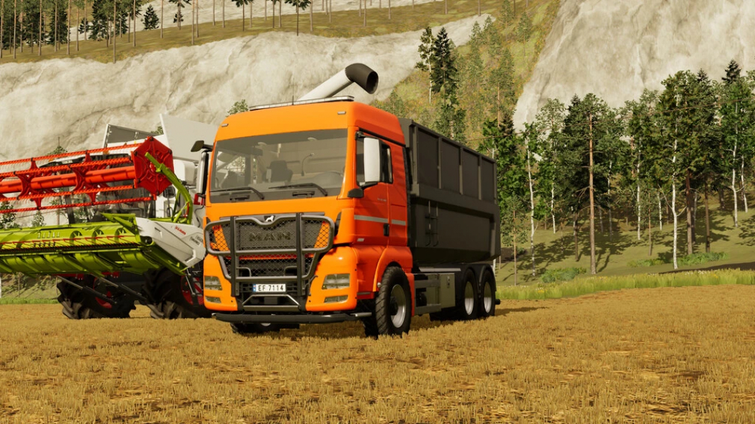 Mod FS22 Man TGX 26.580 v1.0.0.1 dans un champ ouvert avec arbres et machines, améliore le jeu Farming Simulator 22.