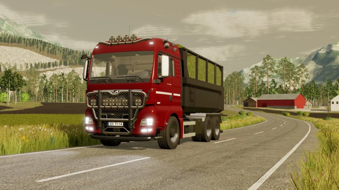 Mod de camion Man TGX 26.580 dans FS22 roulant sur une route de campagne avec des montagnes en arrière-plan.