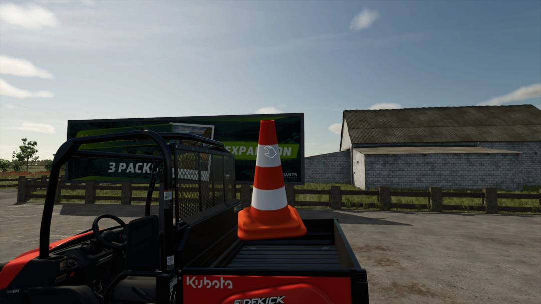 FS25 mod: Movable traffic cone on a vehicle bed near a barn in Farming Simulator 25.