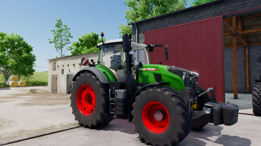 Fendt tractor parked outside a barn in FS25 mods Shader v1.0.0.0.