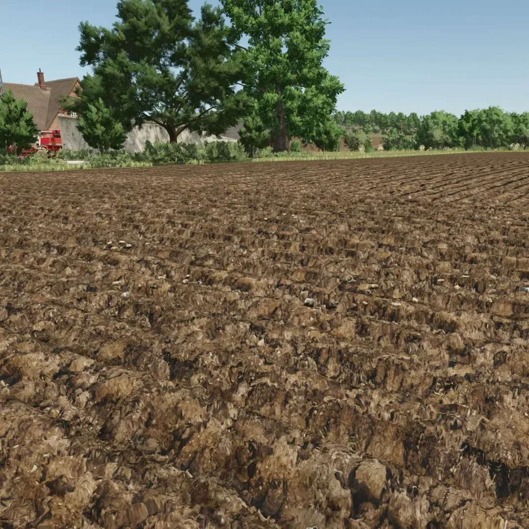 FS25 mod Soil Cultivation Textures v1.0.0.0 showcasing realistic plowed field environment with trees in Farming Simulator 25.