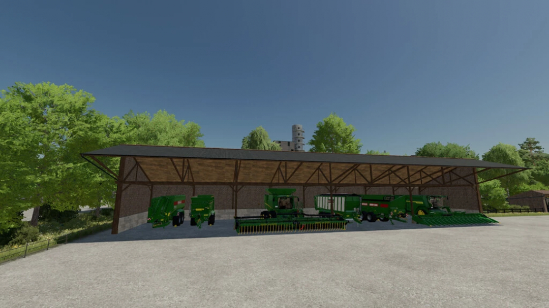 FS22 Stone Farm Pack 2 mod prezentujący zielony sprzęt rolniczy pod wiatą.