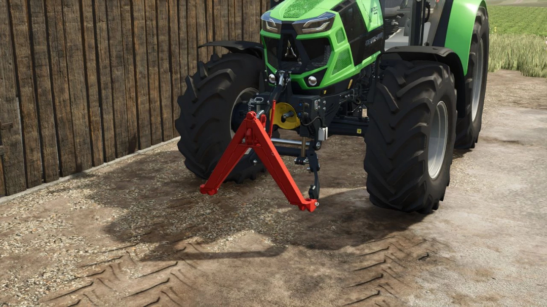 Farming Simulator 25 mod: Tractor with red triangle attachment in front of barn. FS25 mod enhancing gameplay.