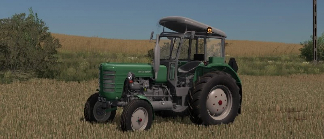 Ursus c-4011 tractor mod in FS22, shown in wheat field, enhancing Farming Simulator 22 experience.