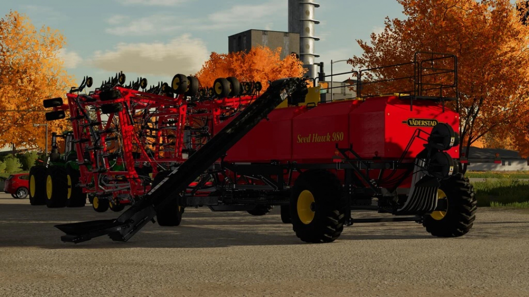 Mod FS22 Vaderstad Seed Hawk 84FT przedstawiony na farmie z jesiennymi drzewami.