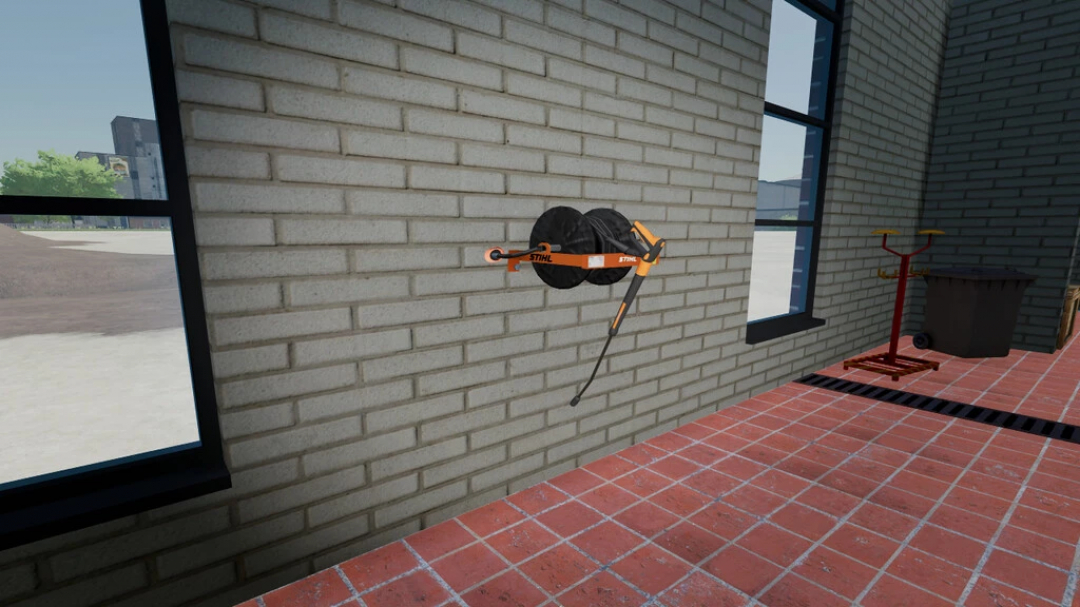 Wall-mounted Stihl High Pressure Washer mod in FS22, showcasing a reel on a brick wall in a workshop setting.