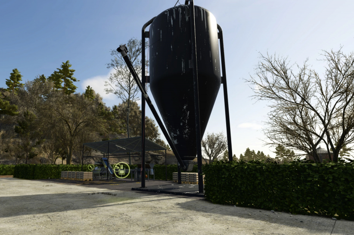 fs25-mods,  Crushed Stone Silo mod in FS25, featuring a tall black silo with a conveyor system in a forested area.