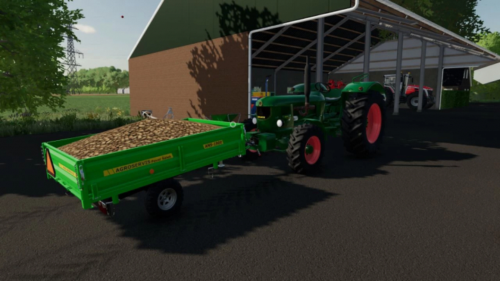 fs22-mods, Deutz-Fahr D9005 mod in FS22, toont een groene tractor die een geladen aanhanger bij een schuur trekt.