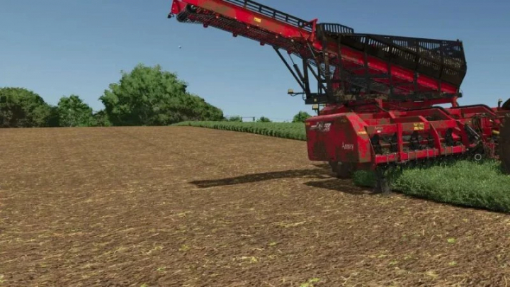 fs25-mods,  FS25 mods: Tillage textures shown with red harvester on cultivated field in Farming Simulator 25.