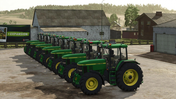 fs25-mods,  Line of John Deere 7010 tractors in Farming Simulator 25, showcasing FS25 mods in a farm setting.