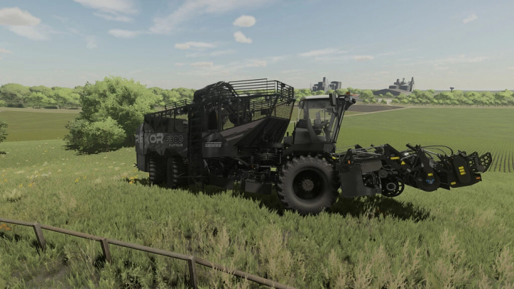 fs22-mods,  Mod FS22 Raxor 6300 Blackhawk mietitrebbia in un campo erboso, mostrando il gameplay di Farming Simulator 22.