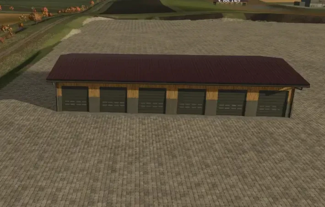 FS25 AustriaModding Drive-through hall v1.0.0.0 featuring a large barn with multiple garage doors on a paved courtyard.