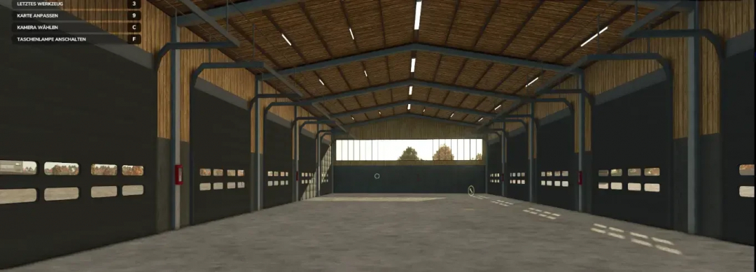 AustriaModding Drive-through Hall in FS25 mod, showcasing a spacious, modern farming structure with overhead lighting.