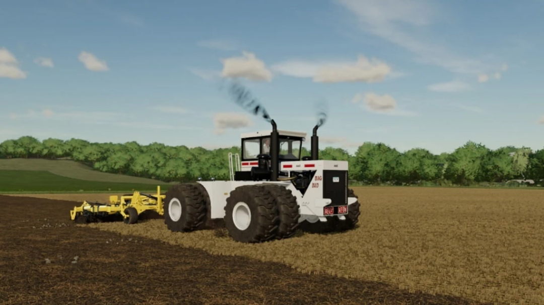 Traktor BigBud S3 v1.0.0.1 mod w FS22, pracuje na polu z drzewami w tle. Modyfikacje Farming Simulator 22.