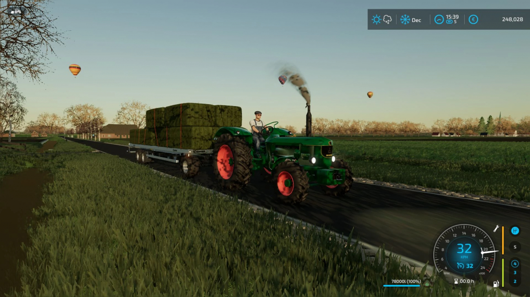 Deutz-Fahr D9005 tractor mod in FS22 hauling hay bales on a sunny day.