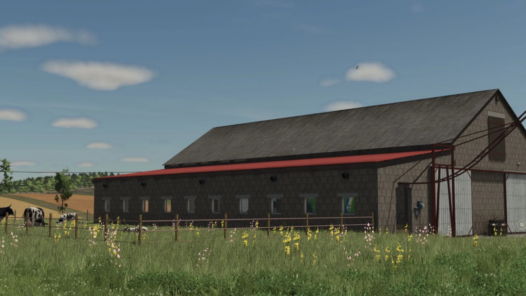 European Style Barn in FS25 mod, surrounded by a grassy field and cattle, under a clear blue sky.