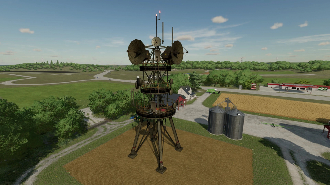 Mod Antena Militar FS22 no Farming Simulator 22. Apresenta uma torre de rádio alta em uma paisagem rural, aumentando o realismo do jogo.