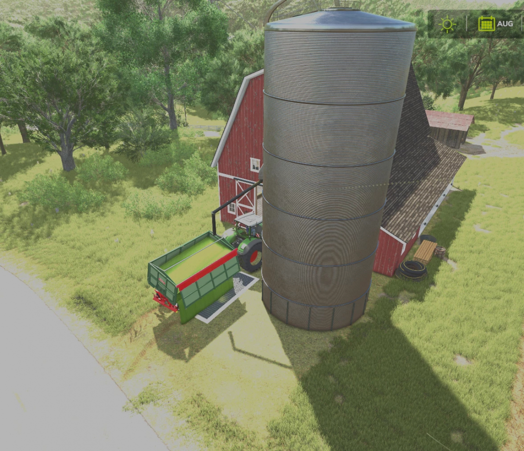 Imagem do mod FS25 mostrando um celeiro com silo ao lado de um trator e reboque em um dia ensolarado.